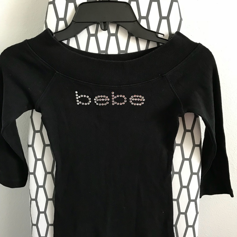 Bebe off shoulder black top. NWOT $29